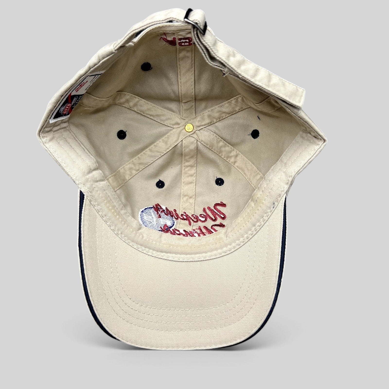 Raree Finds vintage khaki cotton Otto strapback hat with Weeping Wing TKS aviation embroidery on the interior crown