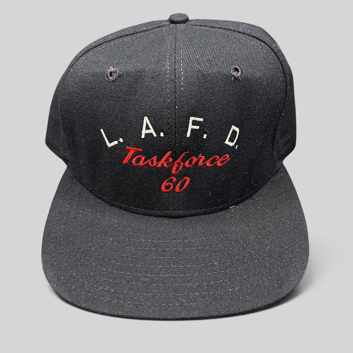 Raree Finds vintage New Era Pro Model LAFD Task Force 60 black snapback hat with red and white embroidered lettering.