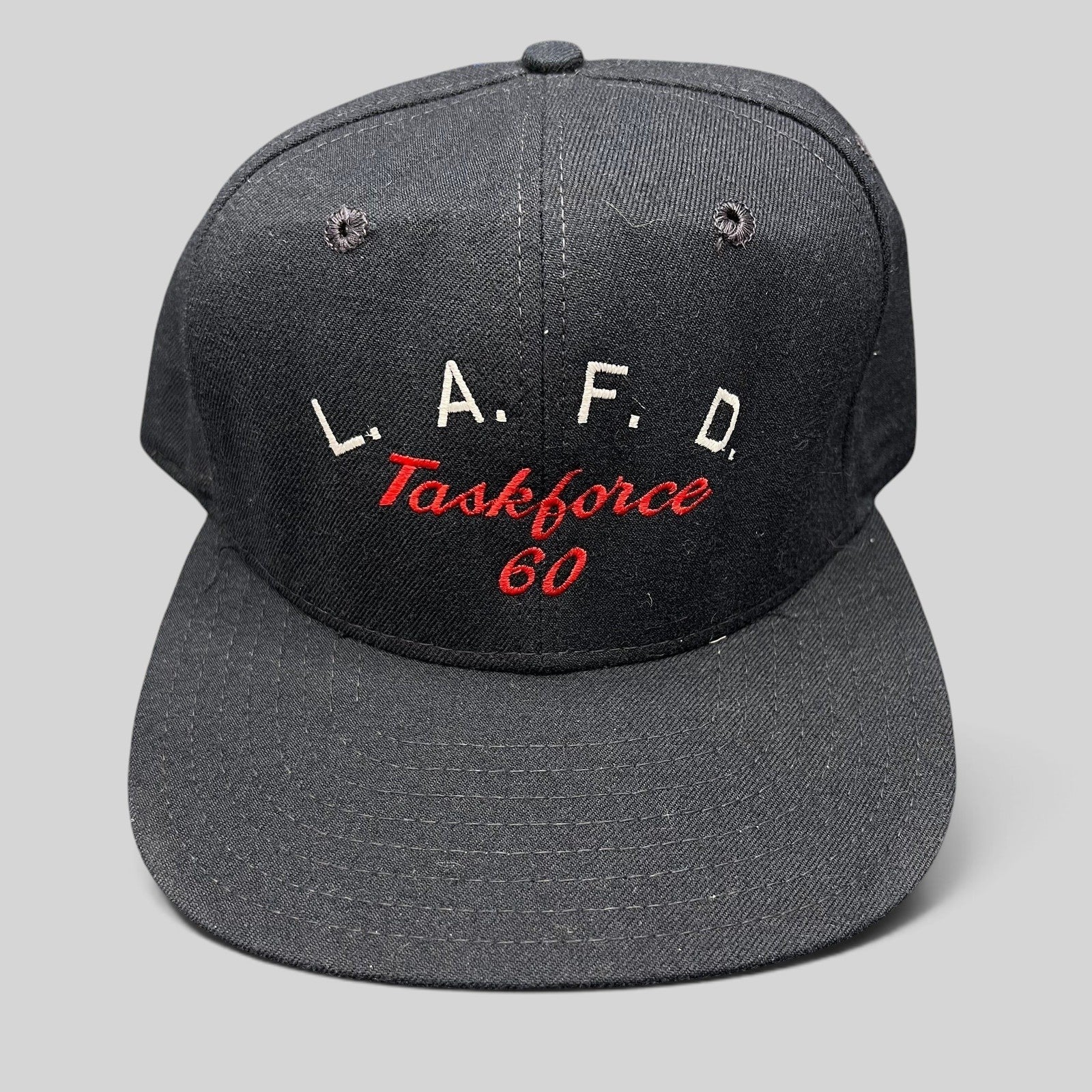 Raree Finds vintage New Era Pro Model LAFD Task Force 60 black snapback hat with red and white embroidered lettering.