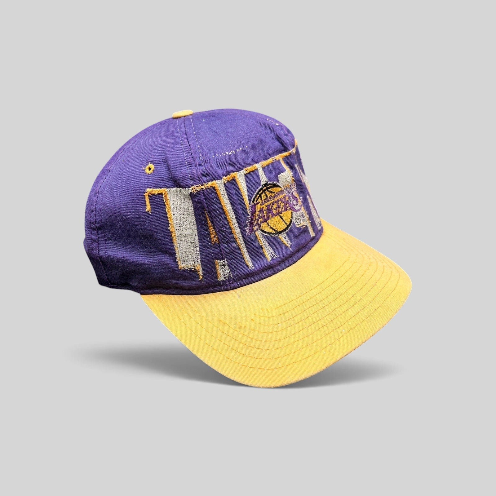 Raree Finds vintage 90s LA Lakers Starter snapback hat in purple and gold with distressed wraparound embroidery
