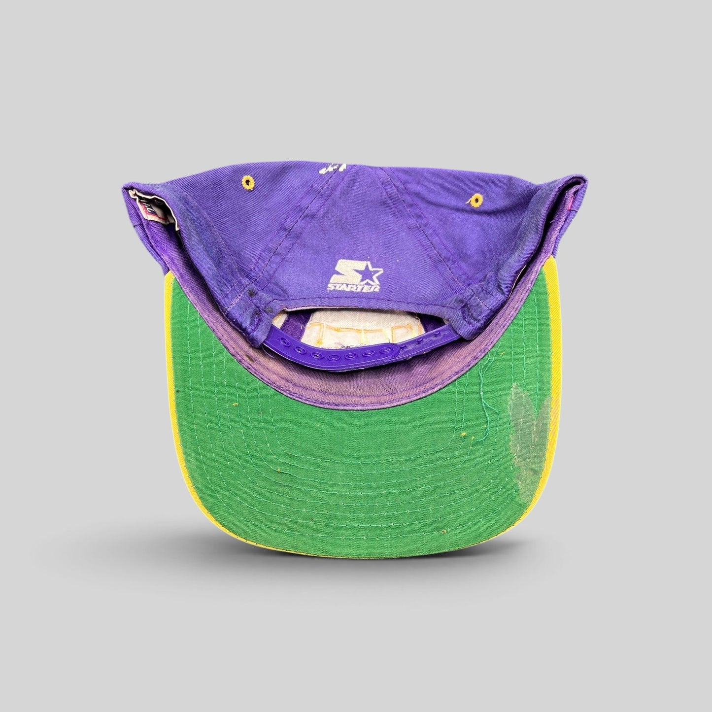 Raree Finds vintage 90s LA Lakers Starter snapback hat showing the purple crown, gold brim, and green undervisor.