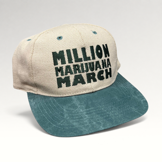 Raree Finds vintage 90s Million Marijuana March snapback hat with a cream textured crown and green brim.