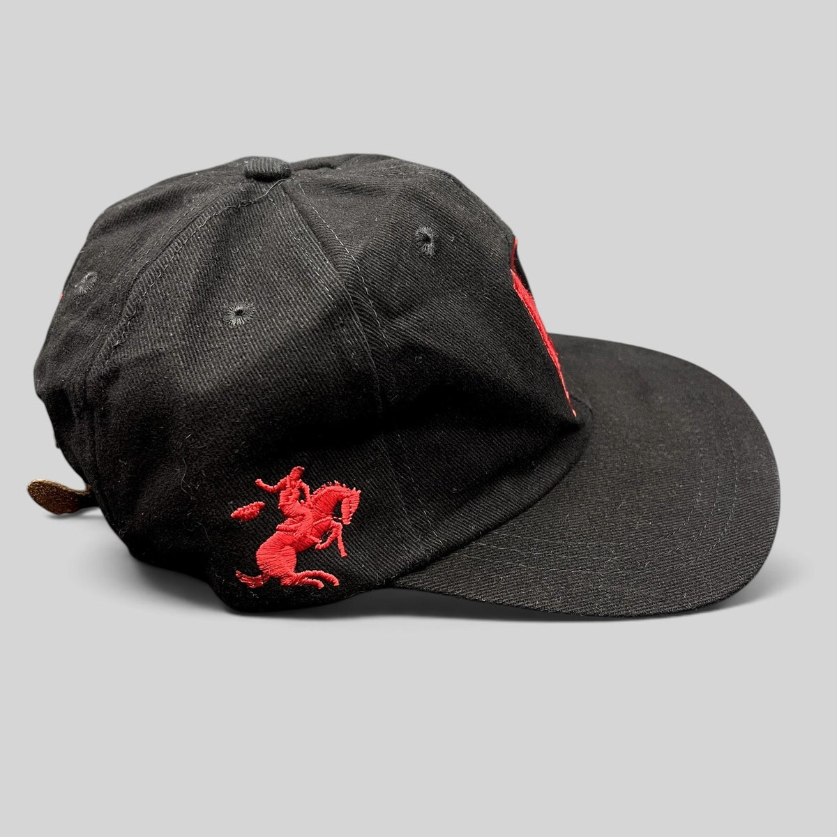 Raree Finds vintage black strapback hat with red embroidered Marlboro horse and rider logo on the side