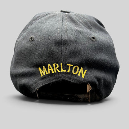 Raree Finds vintage black New Era snapback hat with gold Marlton embroidery on the back and adjustable plastic strap.