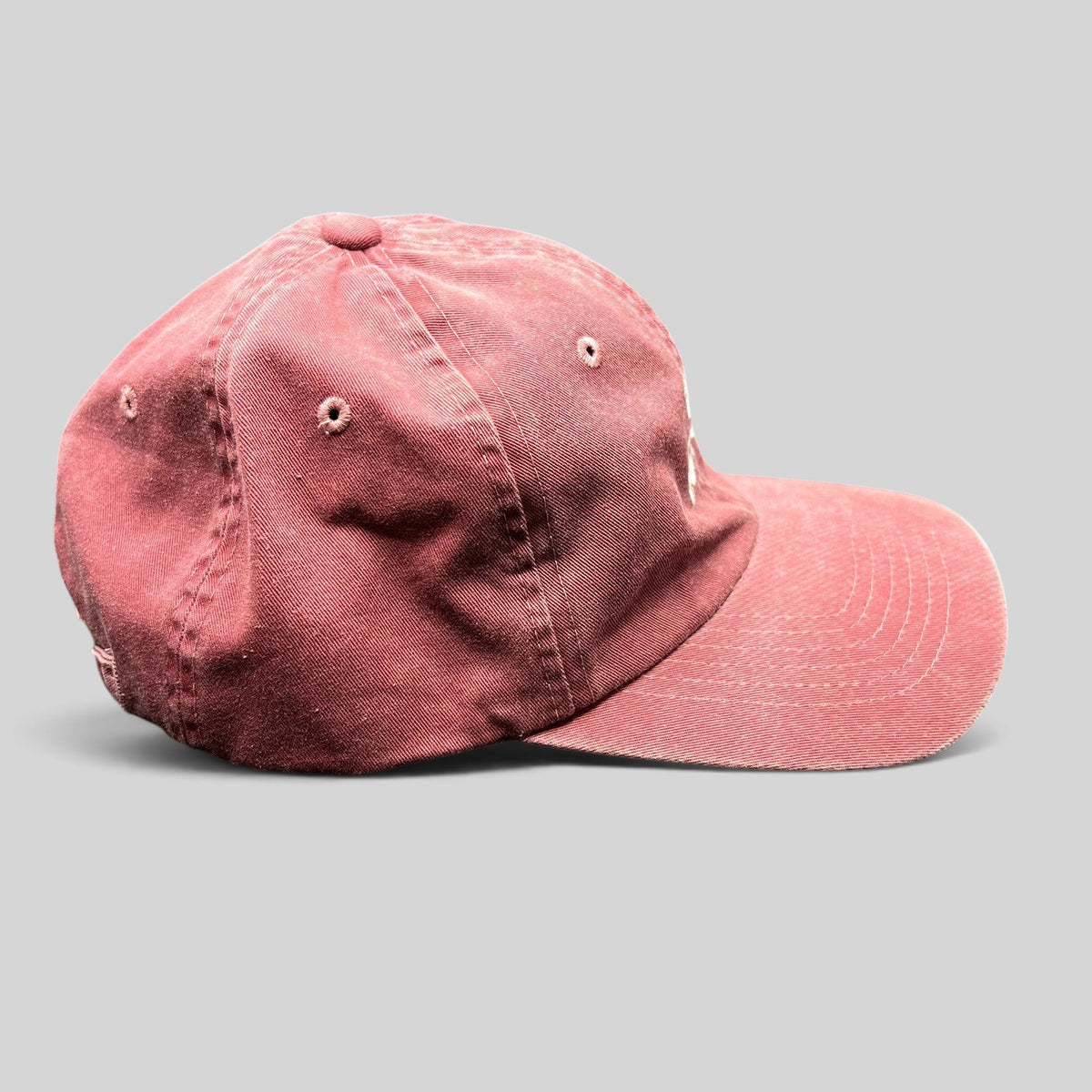 Raree Finds vintage maroon cotton dad cap by Sportsman with an unstructured fit and adjustable strapback closure.