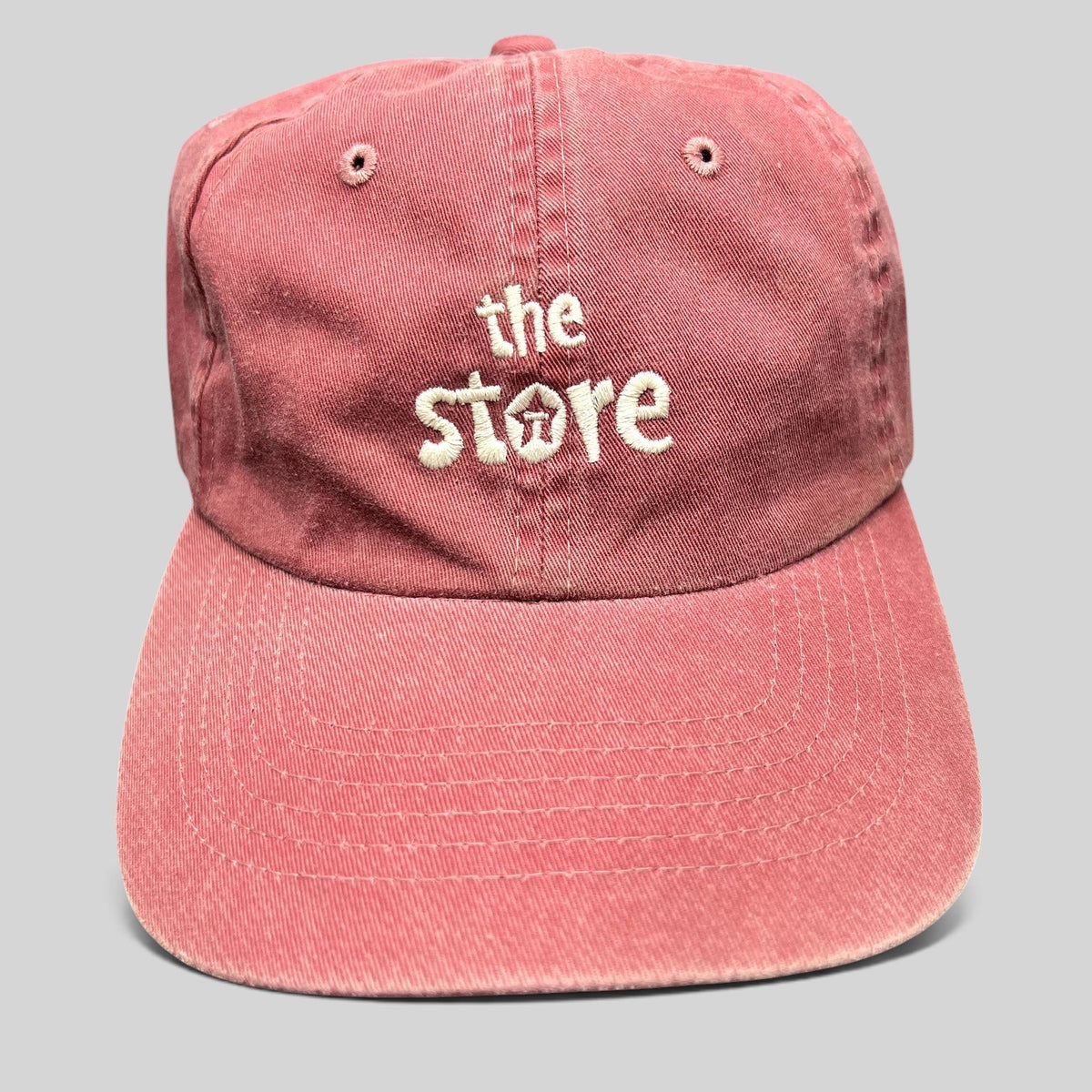 Raree Finds vintage maroon cotton dad cap with white embroidered The Store logo and unstructured strapback design