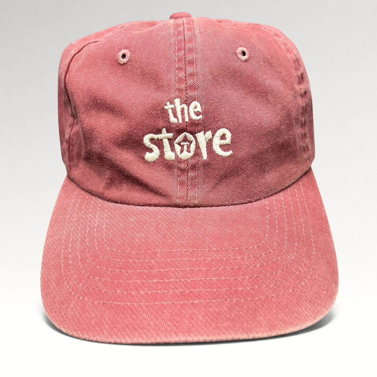 Raree Finds vintage maroon cotton dad cap with white embroidered The Store logo and unstructured strapback design
