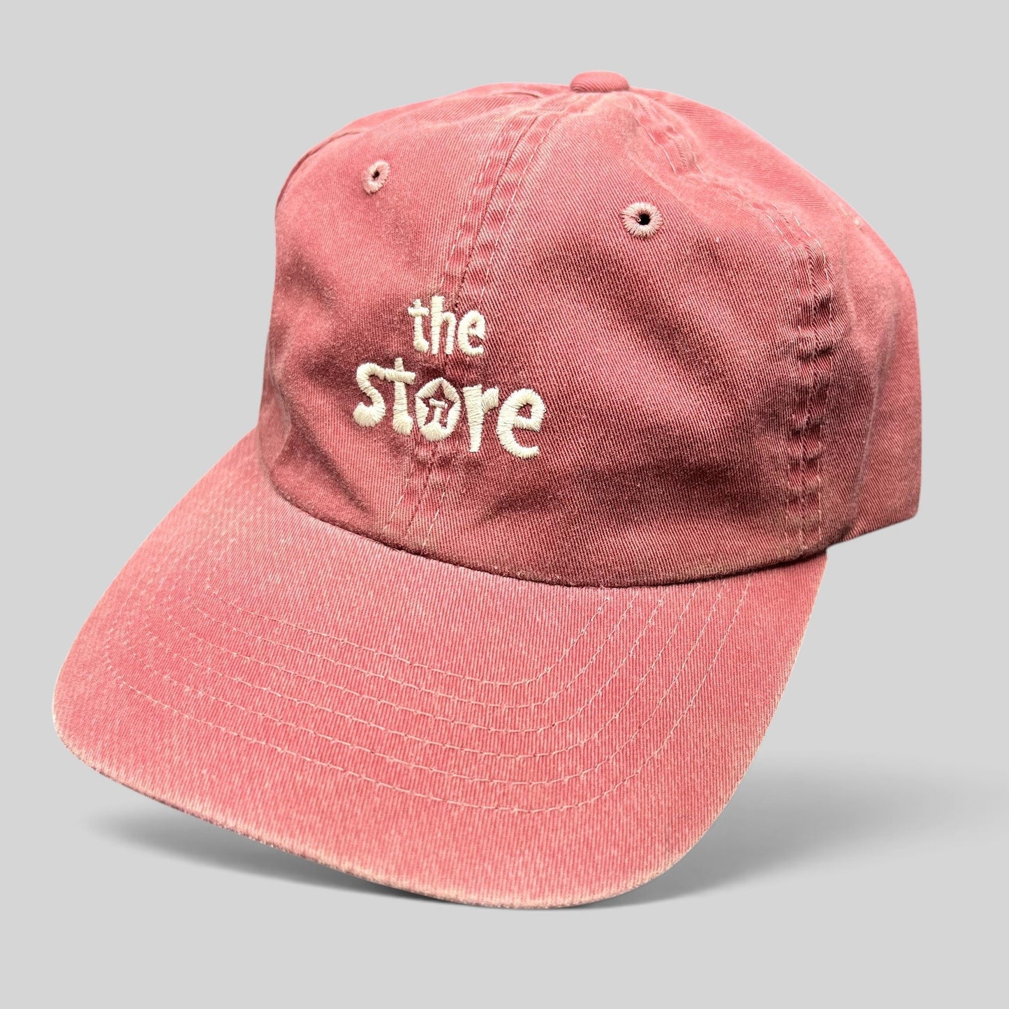 Raree Finds vintage maroon cotton Sportsman dad cap with embroidered The Store logo and adjustable strapback closure.
