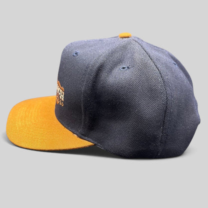 Raree Finds vintage navy and tan OTTO Cap snapback hat featuring a Melody Ranch Motion Picture Studio longhorn logo.