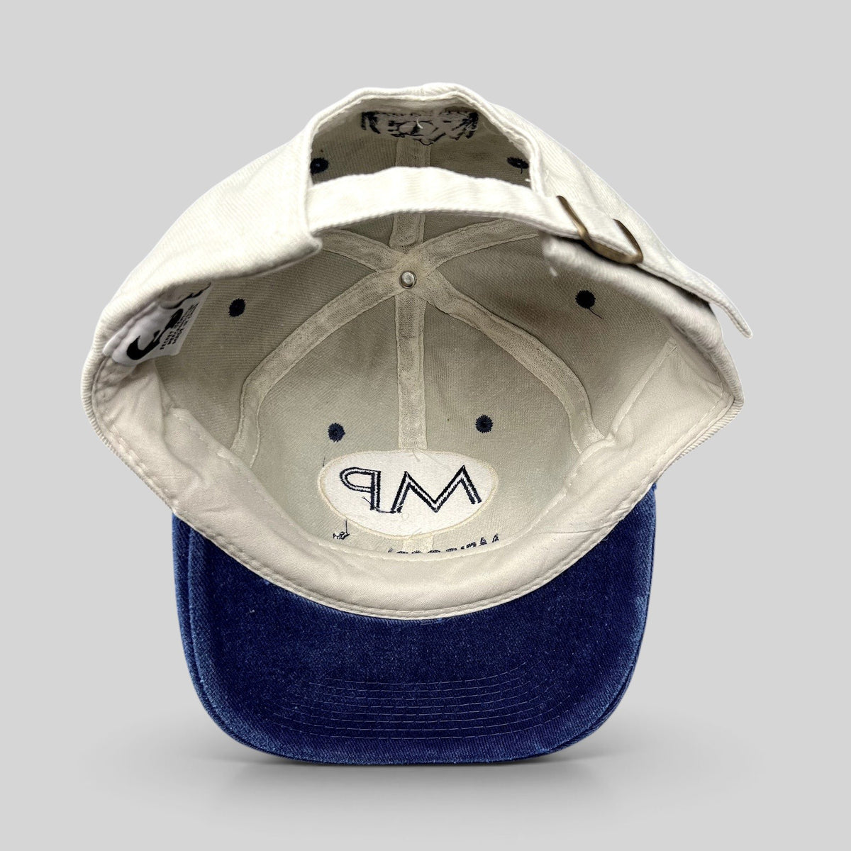 Raree Finds vintage Melrose Place FOX TV show strapback hat with cream crown, blue brim, and interior MP logo detail.