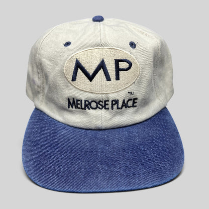 Raree Finds vintage Melrose Place FOX TV show strapback hat with cream crown, blue brim, and navy embroidered logo.