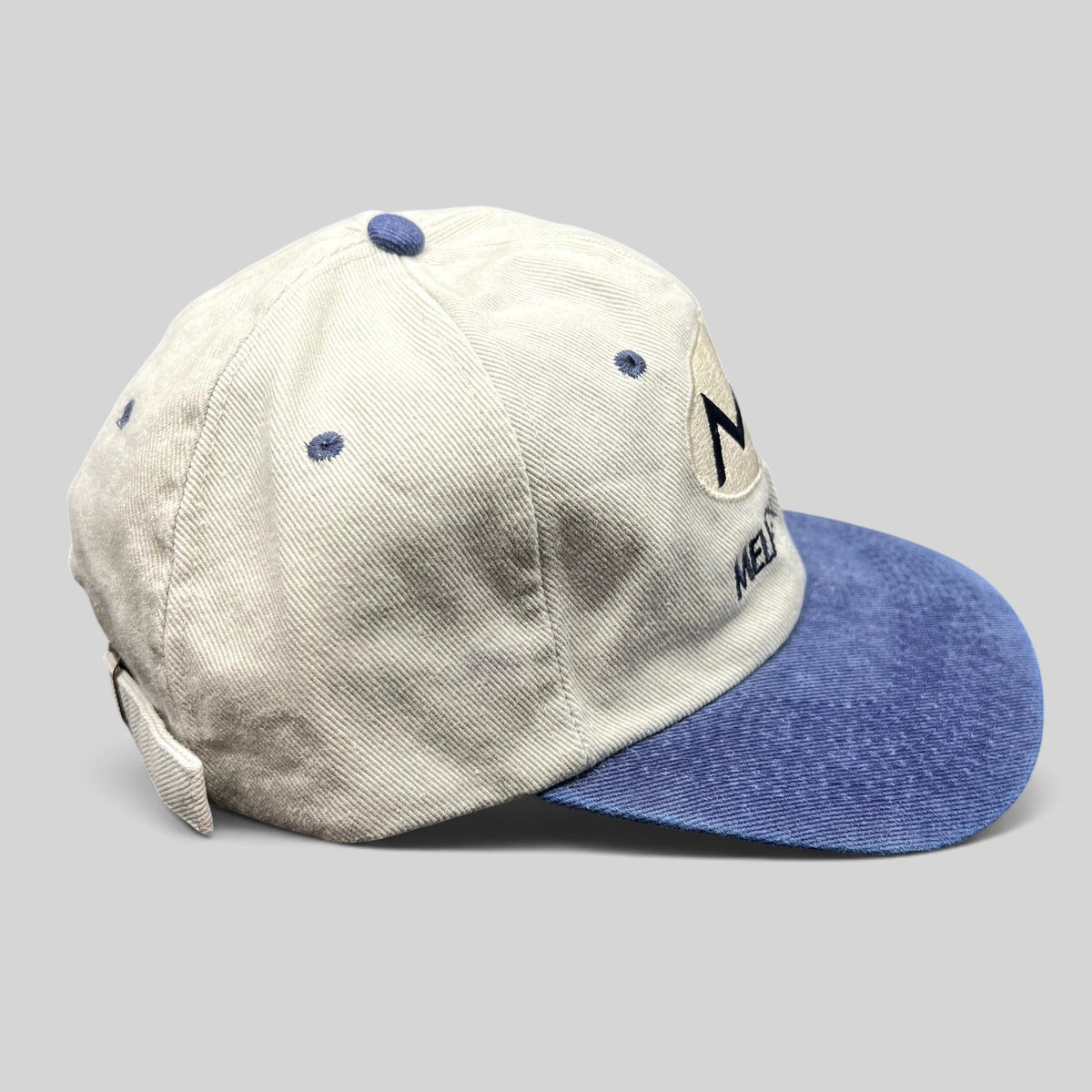 Raree Finds vintage 90s Melrose Place FOX TV show strapback hat with cream crown, blue brim, and embroidered logo.