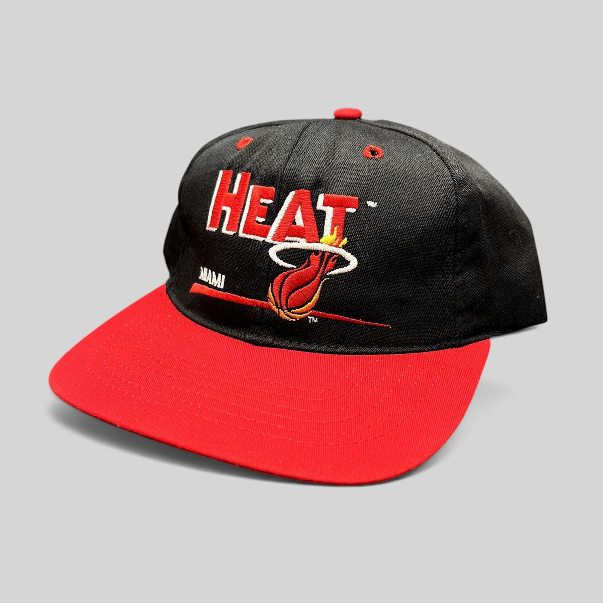 Raree Finds vintage 1990s Miami Heat NBA snapback hat with black crown, red brim, and embroidered team logo.