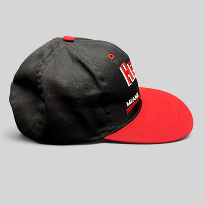 Raree Finds vintage 1990s Miami Heat snapback hat with black crown, red brim, and embroidered team logo.