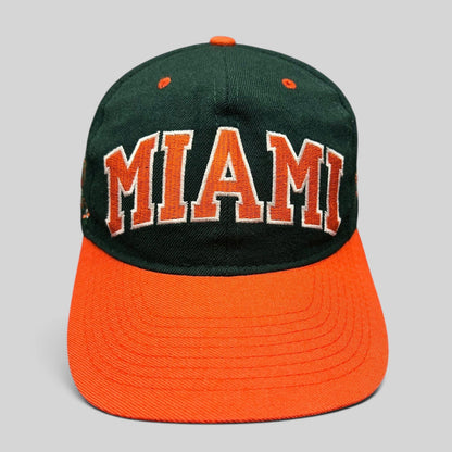 Raree Finds vintage Miami Hurricanes fitted hat with green crown, orange brim, and arched MIAMI embroidery.