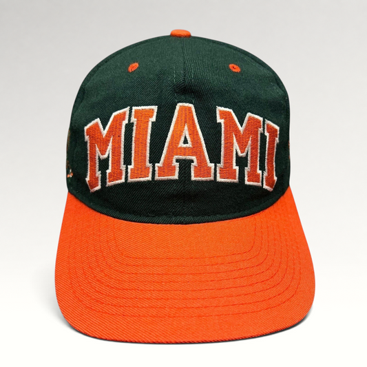 Raree Finds vintage Miami Hurricanes fitted hat with green crown, orange brim, and arched MIAMI embroidery.
