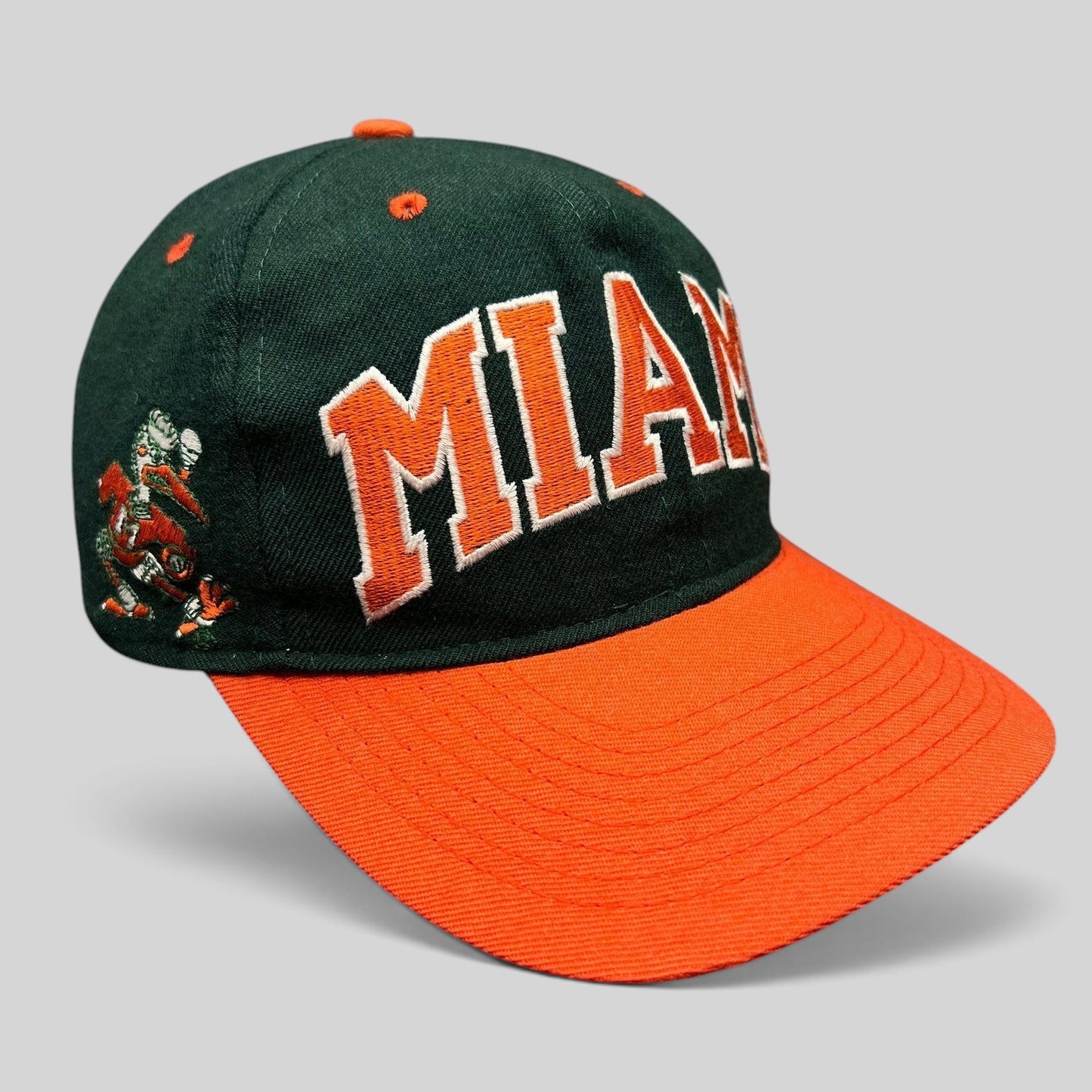 Raree Finds vintage Miami Hurricanes wool fitted hat with green crown, orange brim, and arched Miami embroidery.