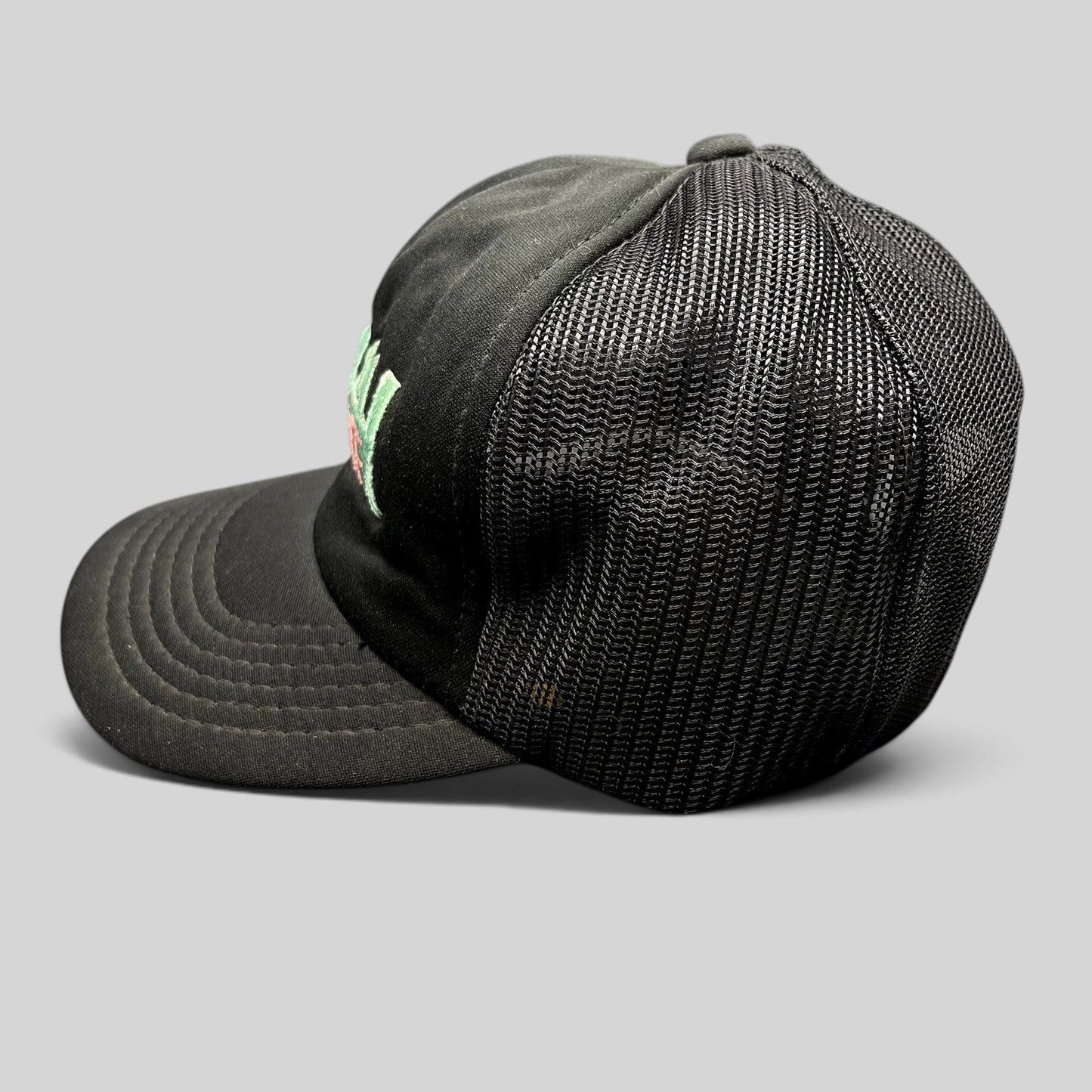 Raree Finds vintage Miami Vice black mesh trucker hat with teal and pink embroidered logo and snapback closure