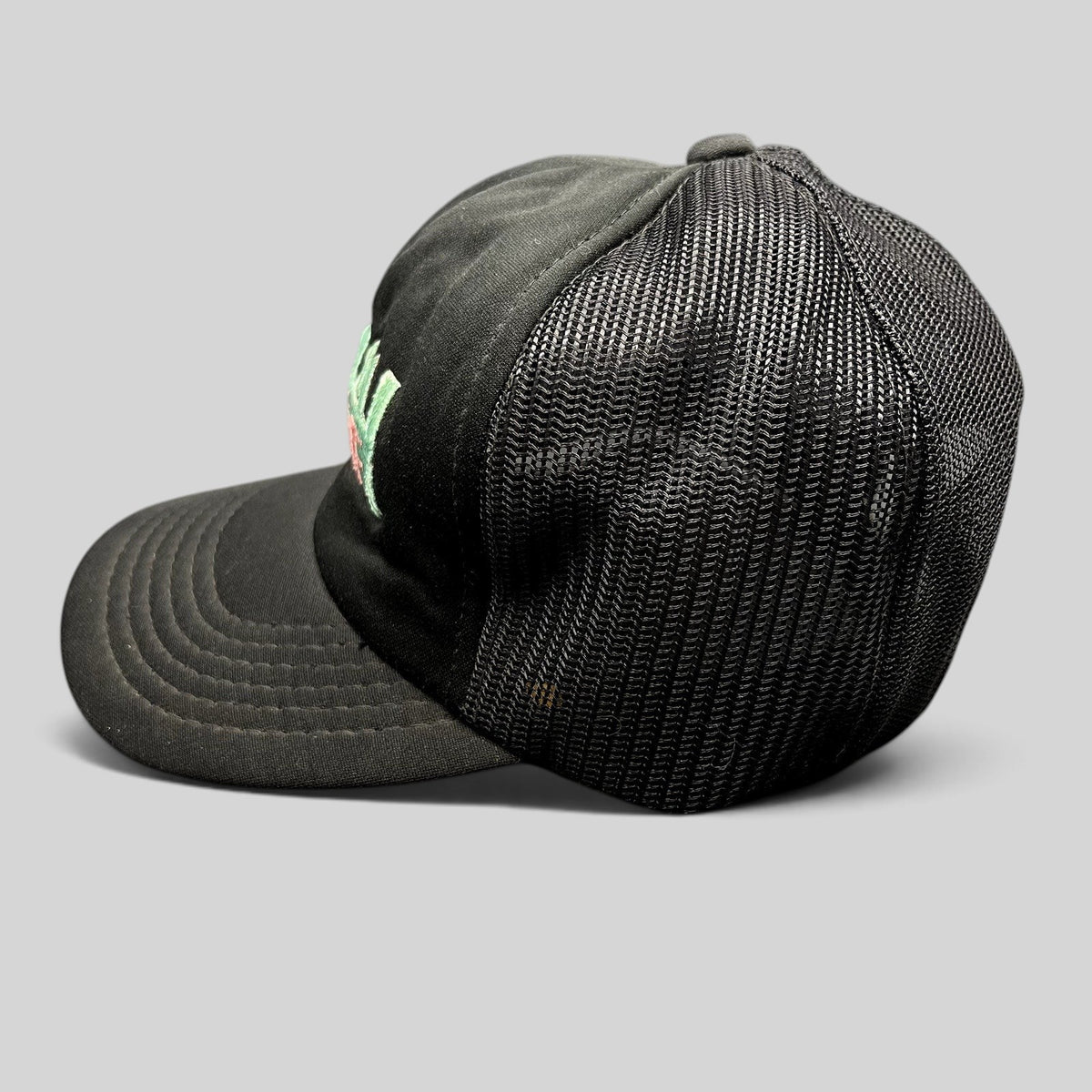 Raree Finds vintage Miami Vice black mesh trucker hat with teal and pink embroidered logo and snapback closure