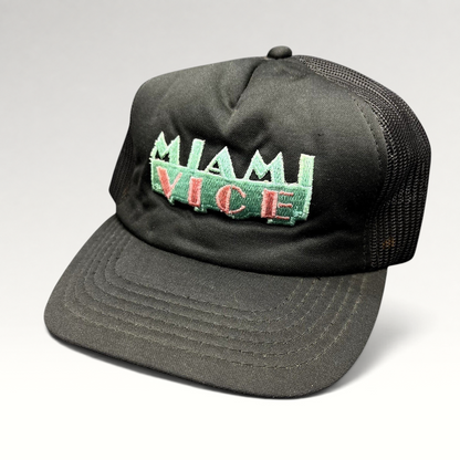 Raree Finds vintage Miami Vice black foam and mesh trucker hat with teal and pink embroidered logo and snapback.