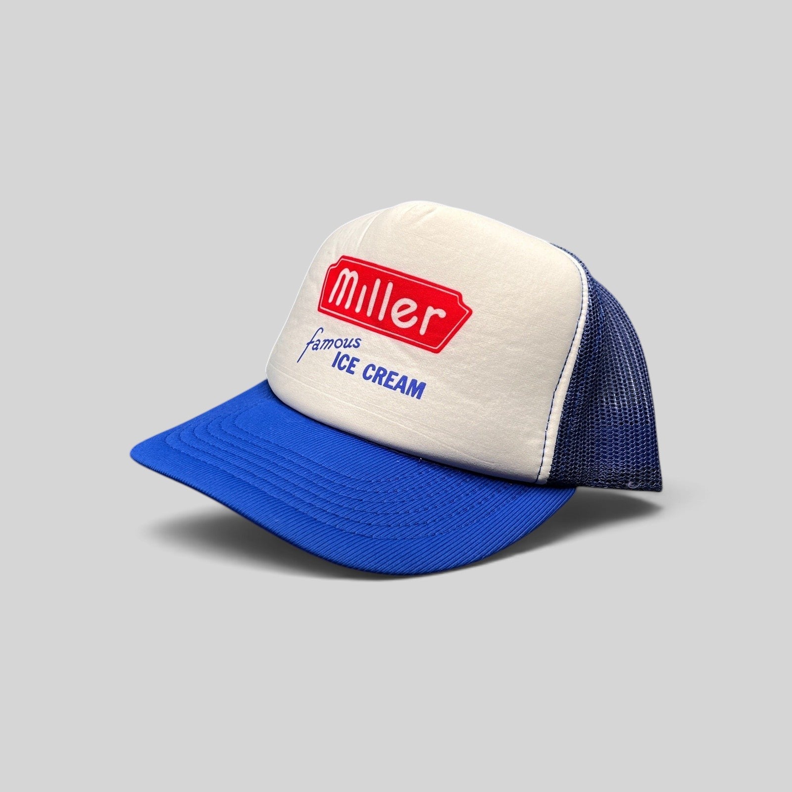 Raree Finds vintage Miller Famous Ice Cream trucker hat with white foam front, royal blue mesh back, and snapback.