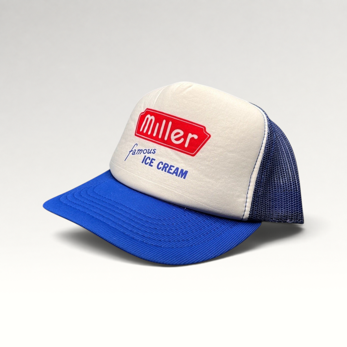 Raree Finds vintage Miller Famous Ice Cream trucker hat with white foam front, royal blue mesh back, and snapback.