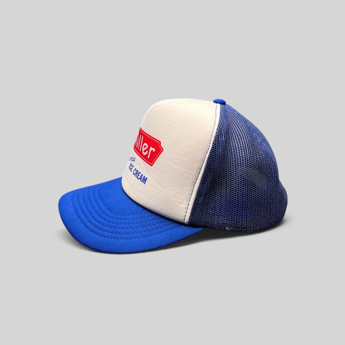 Raree Finds vintage 80s Miller Famous Ice Cream trucker hat with white foam front, royal blue mesh, and snapback.