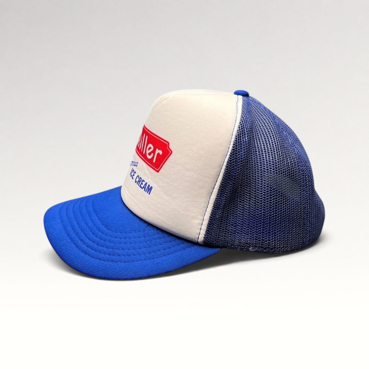 Raree Finds vintage 80s Miller Famous Ice Cream trucker hat with white foam front, royal blue mesh, and snapback.