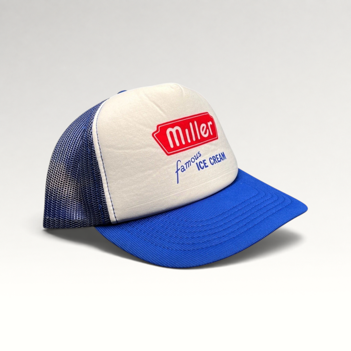 Raree Finds vintage Miller Famous Ice Cream trucker hat with white foam front, royal blue mesh, and snapback closure.