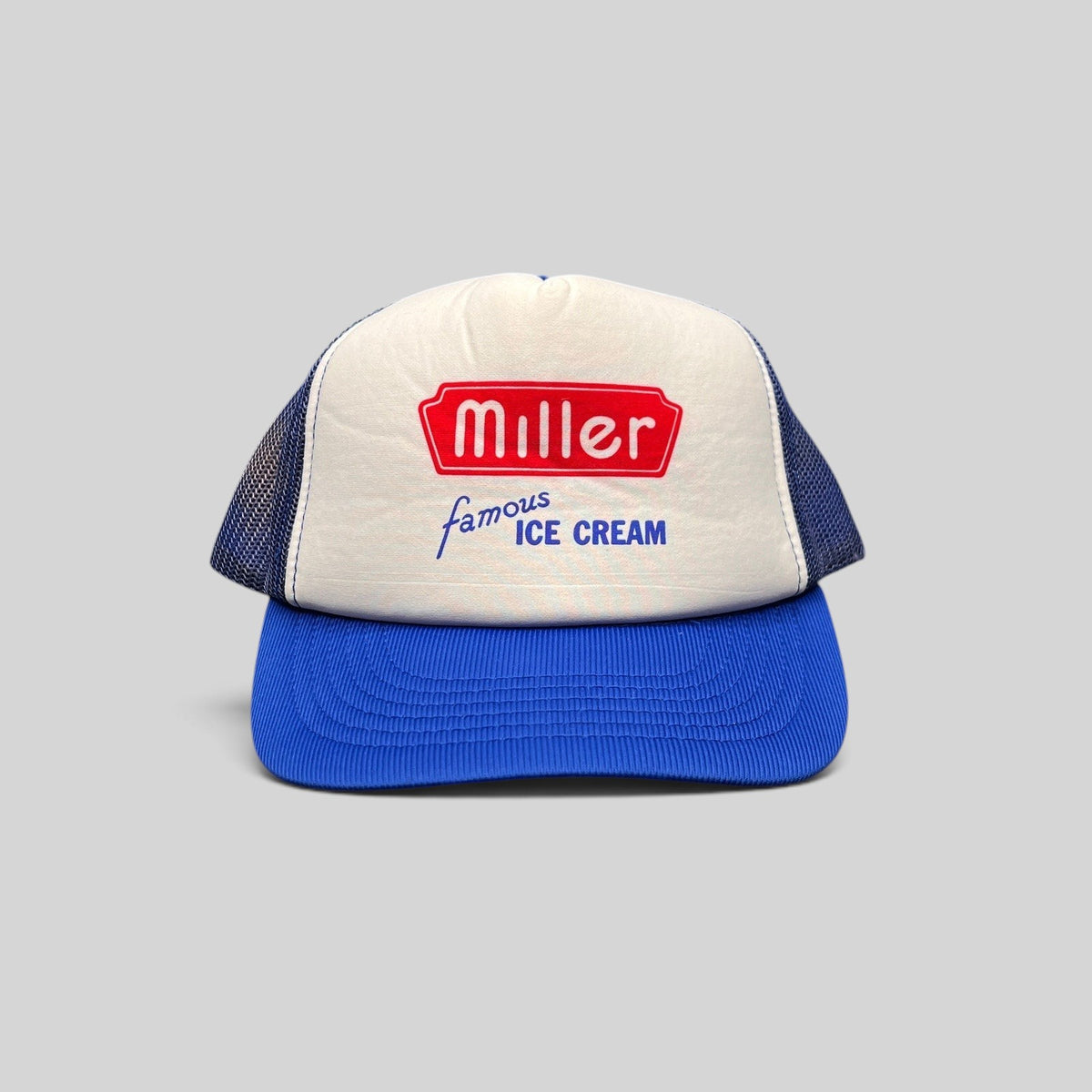 Raree Finds vintage 80s Miller Famous Ice Cream trucker hat with white foam front, royal blue mesh, and snapback.
