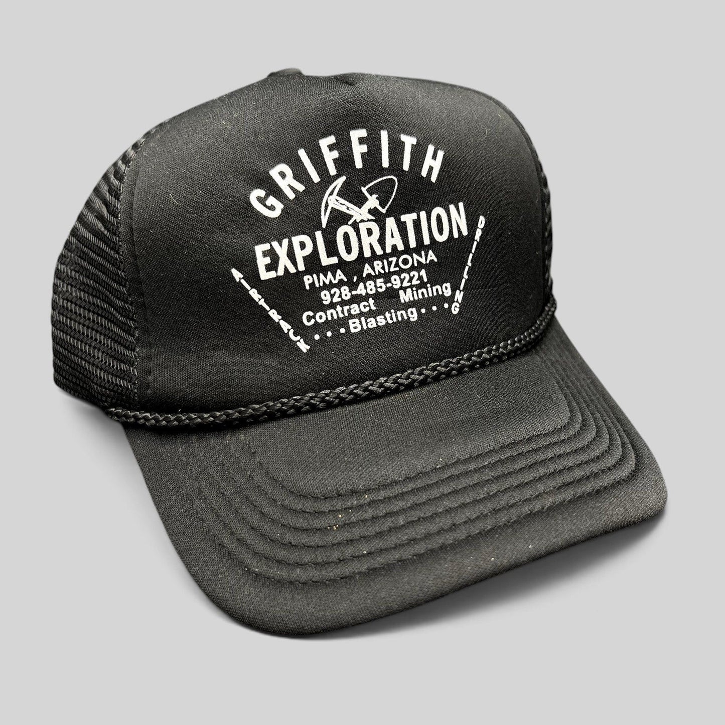Raree Finds vintage black foam trucker hat with white Griffith Exploration mining company graphic and braided rope