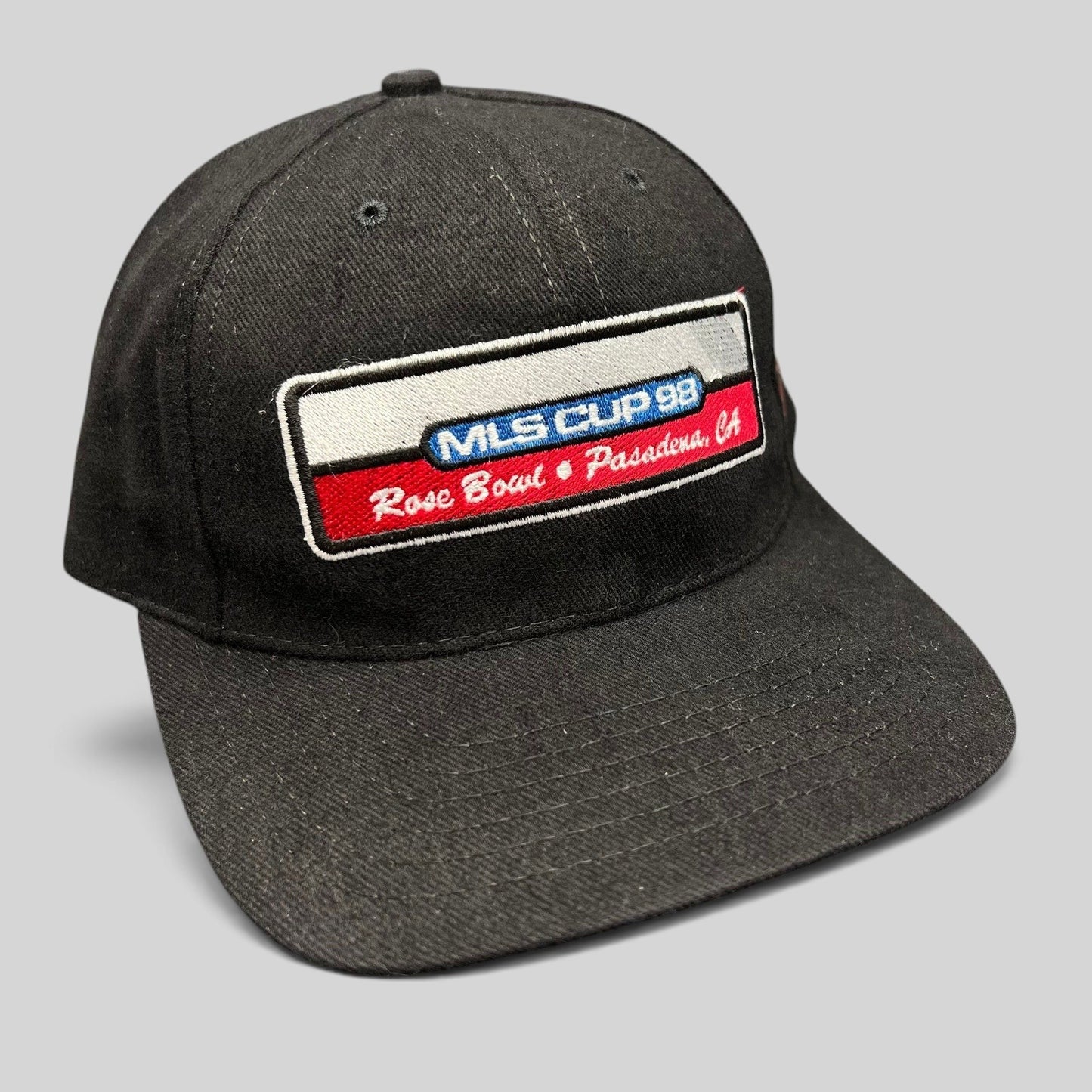Raree Finds vintage 1998 MLS Cup black strapback hat with embroidered Rose Bowl patch and DC United side pin