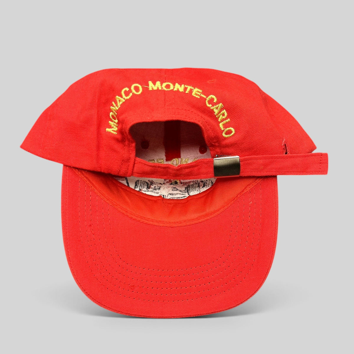 Raree Finds vintage red Monaco Grand Prix strapback hat with yellow Monaco Monte-Carlo embroidery on the back
