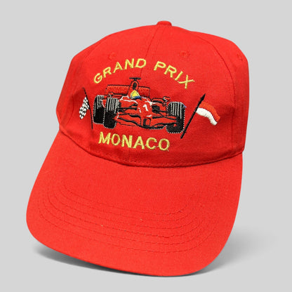 Raree Finds vintage red Monaco Grand Prix strapback hat with embroidered Formula 1 race car and checkered flag detail.