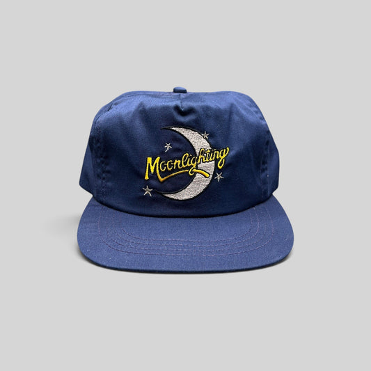 Raree Finds vintage 1980s Moonlighting TV show navy blue snapback hat with embroidered crescent moon and star logo.
