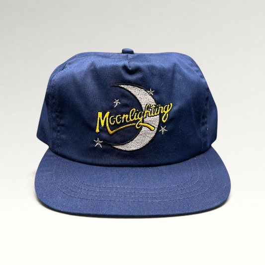 Raree Finds vintage 1980s Moonlighting TV show navy blue snapback hat with embroidered crescent moon and star logo.