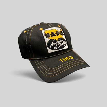 Raree Finds vintage black cotton NAPA Auto Parts strapback cap with yellow contrast stitching and 1963 brim embroidery.