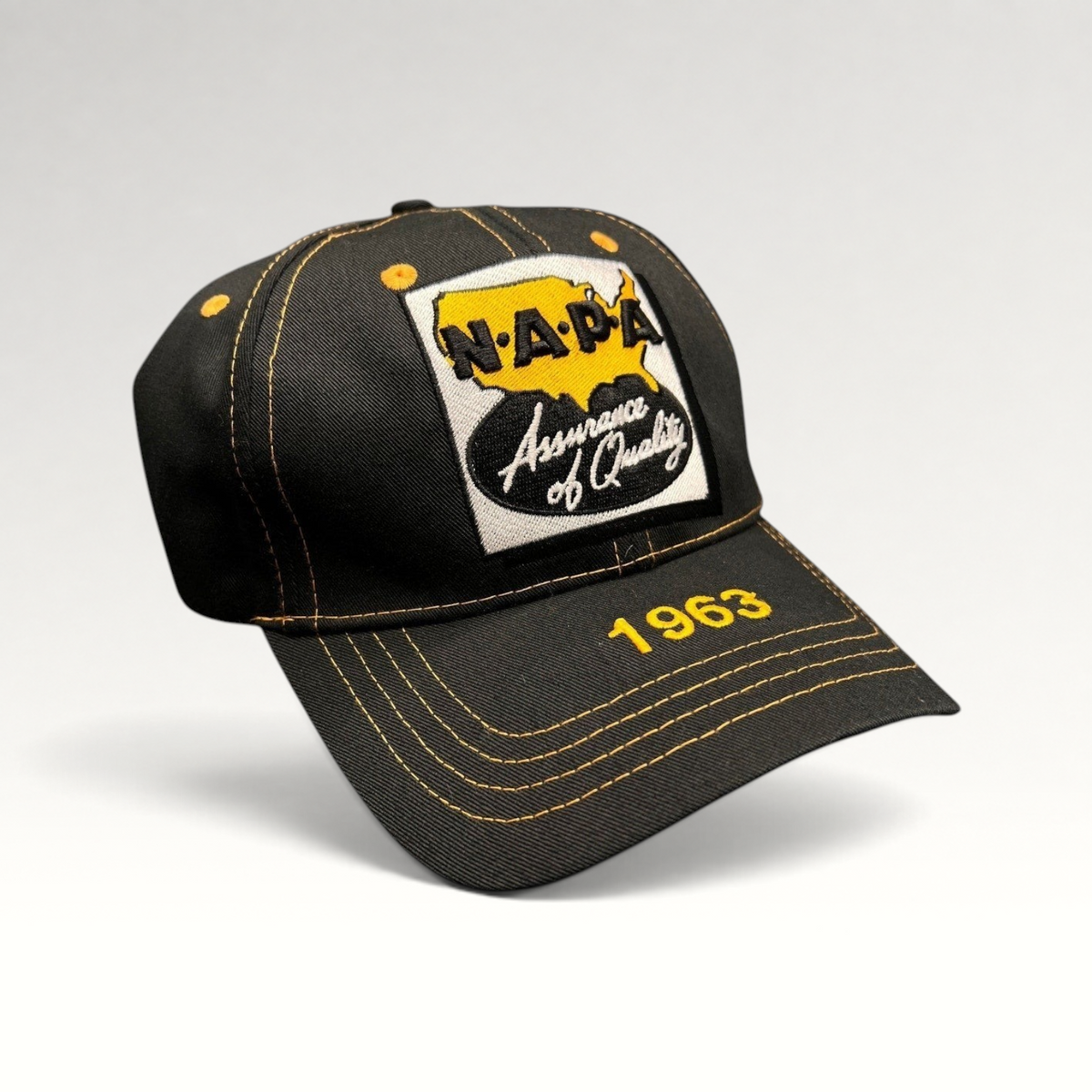 Raree Finds vintage black cotton NAPA Auto Parts strapback cap with yellow contrast stitching and 1963 brim embroidery.