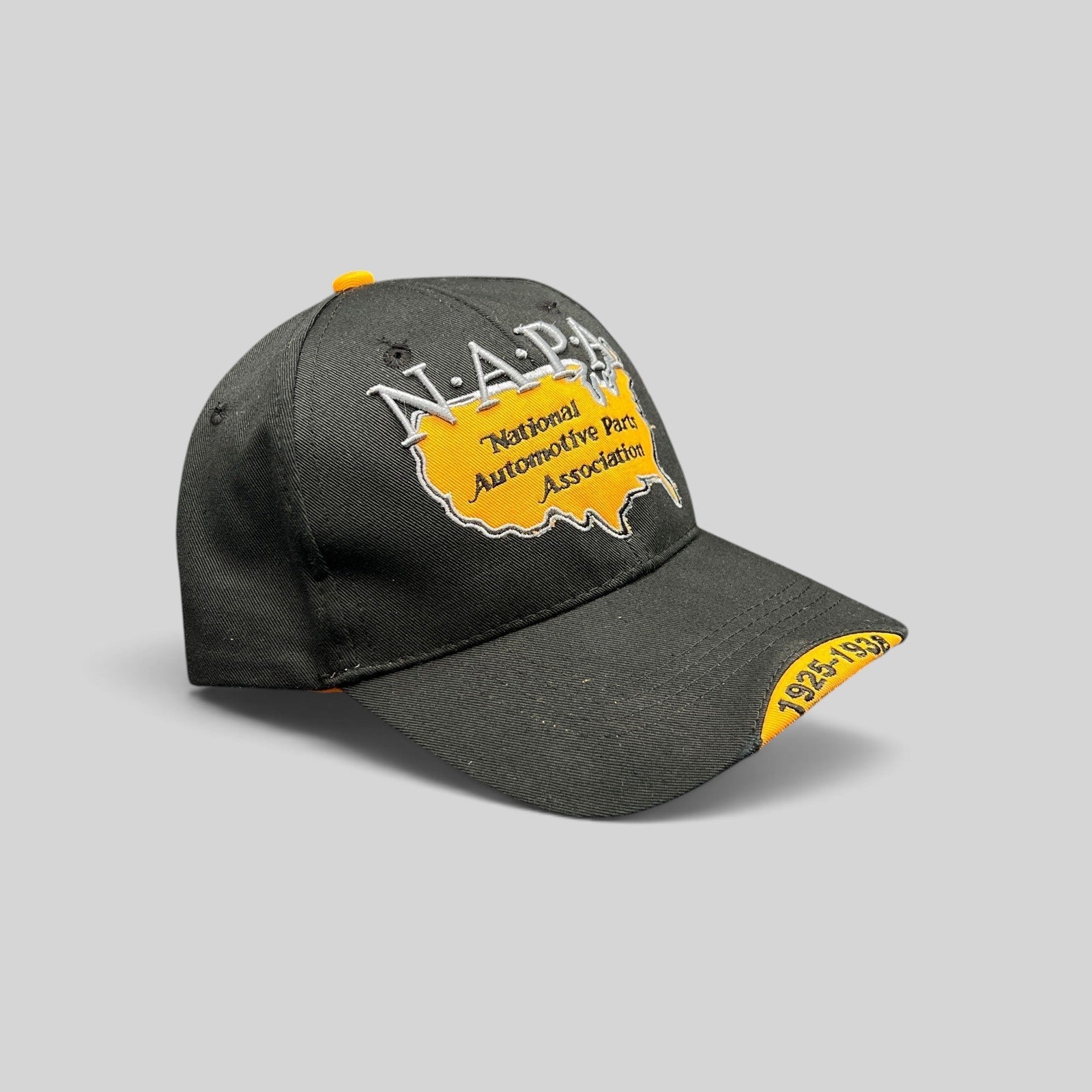 Raree Finds vintage black NAPA cotton strapback hat with yellow USA map embroidery and 1925-1938 bill detail