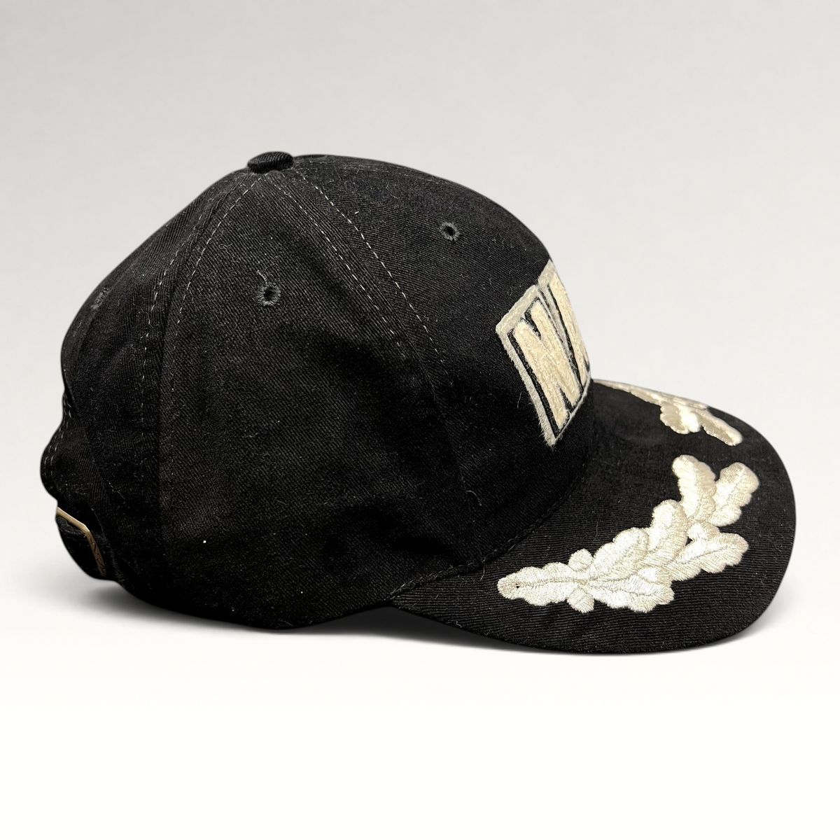 Raree Finds vintage American Needle black cotton strapback hat with cream NASA logo and embroidered brim leaf design
