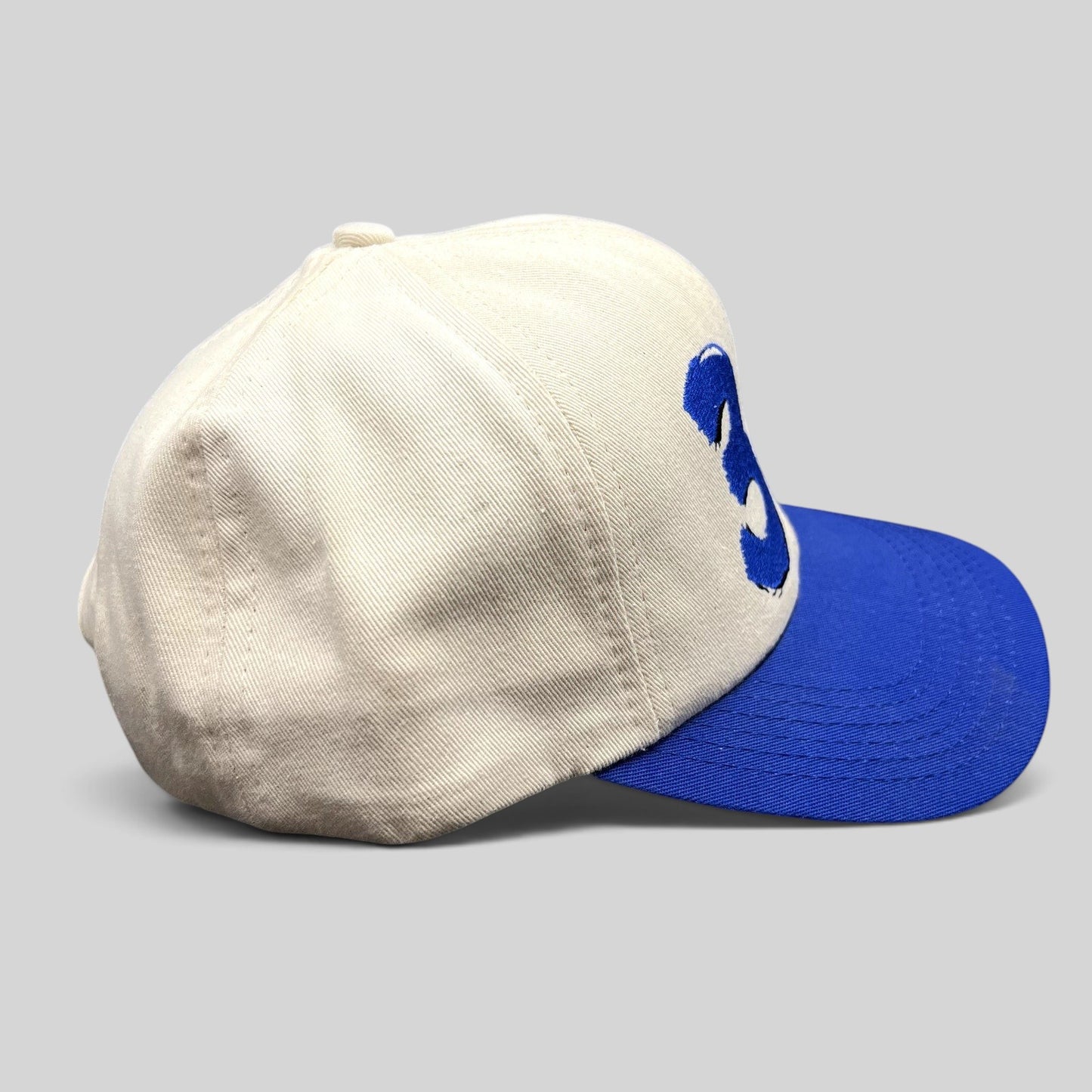 Raree Finds vintage Ken Schrader #36 NASCAR snapback hat in cream and royal blue with embroidered racing graphics.