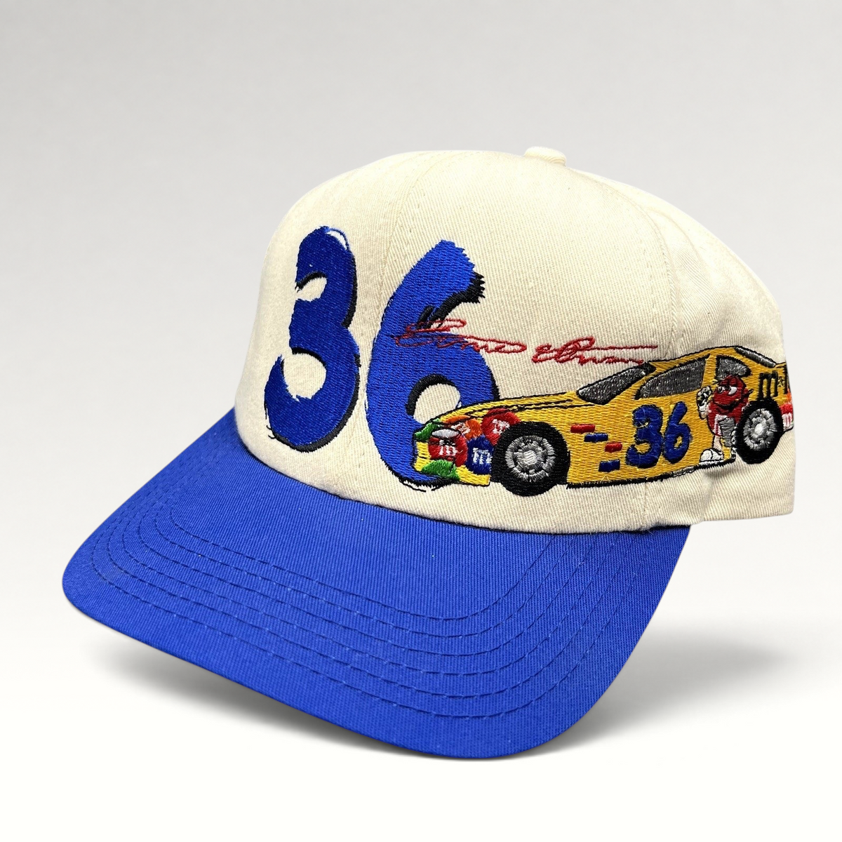 Raree Finds vintage Ken Schrader #36 NASCAR snapback hat with cream crown, royal blue brim, and embroidered race car.