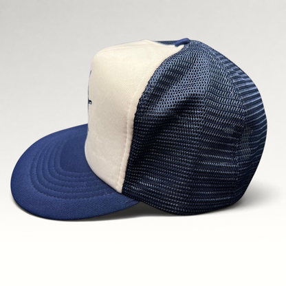 Raree Finds vintage Sunbelt trucker hat with white foam front, navy mesh back, and nautical ship wheel graphic.