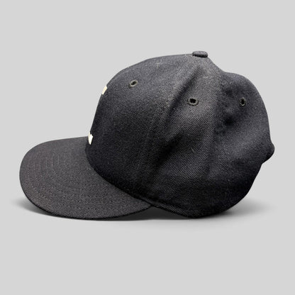Raree Finds vintage New Era USA made navy wool snapback hat with interlocking FL embroidery and gray undervisor