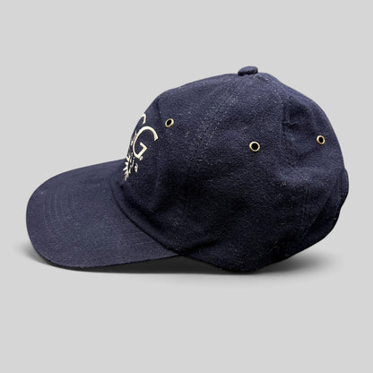 Raree Finds vintage navy blue cotton UGG Australia strapback hat with embroidered logo and brass ventilation eyelets