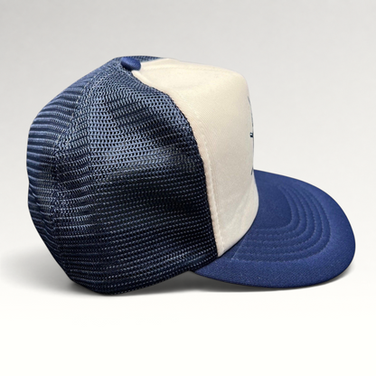 Raree Finds vintage Sunbelt snapback trucker hat with a white foam front, navy mesh back, and navy brim.