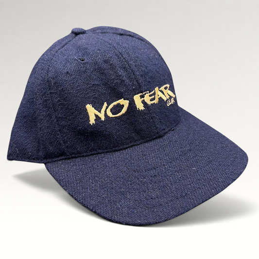 Raree Finds vintage 90s navy wool-blend snapback hat with gold No Fear Gear embroidery and structured six-panel design.