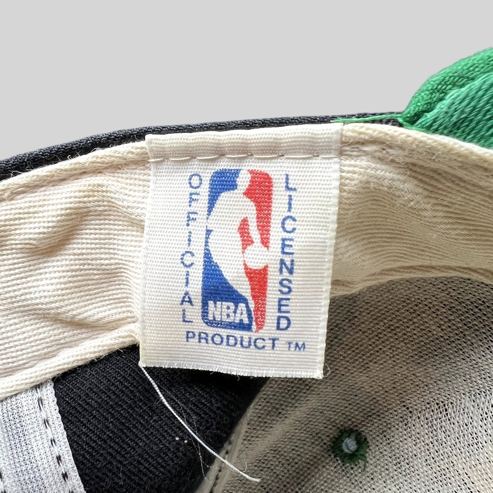 Raree Finds vintage New Era NBA official licensed product tag inside a Milwaukee Bucks snapback hat