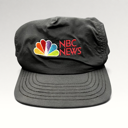 Raree Finds vintage 90s black nylon NBC News snapback hat with embroidered peacock logo and red lettering