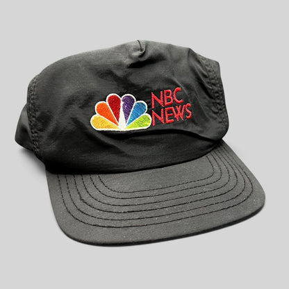 Raree Finds vintage 90s black nylon NBC News snapback hat with embroidered peacock logo and red lettering